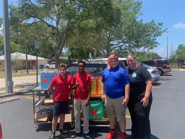 Mildred Helms Elementary students, Nicholas Demello, Denzel Antwi and Kenneth Gaither, conducted a food drive at school, and their efforts resulted in a donation of over 200 items to the PCS Pantry.